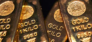 Gold dips as surging U.S. housing data sends dollar rising
